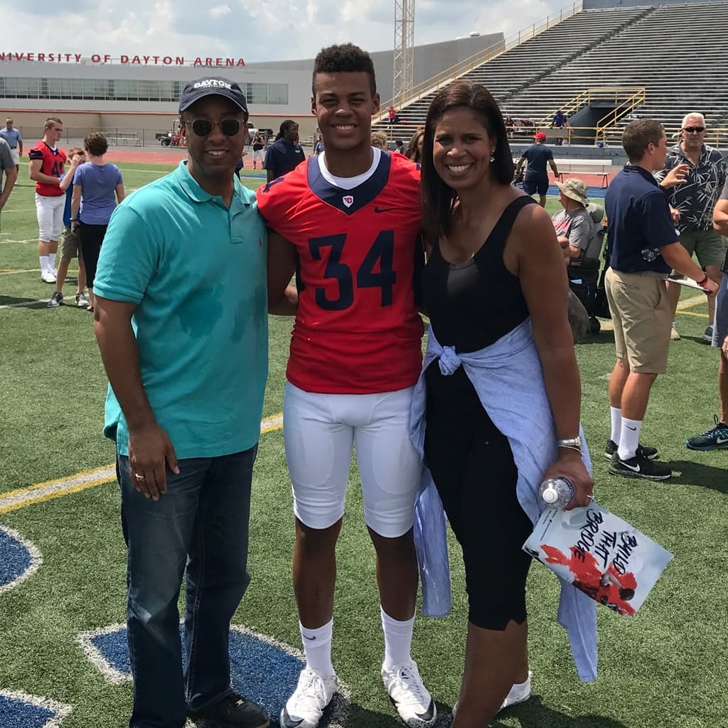 Evan Frazier Jr. with his parents