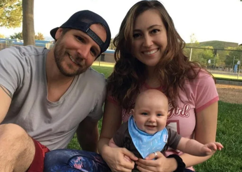 Justin Cassotta with his wife and kid